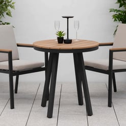 Elegant outdoor patio table set with two modern chairs, perfect for garden or backyard dining, featuring durable frames and comfortable cushions.