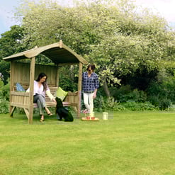 Solid wood garden gazebo with seating, outdoor landscaping, and lush greenery for backyard patio and outdoor entertaining.
