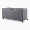 Versatile gray outdoor storage chest with wheels, ideal for garden or patio organization, made from durable weather-resistant materials for outdoor use and long-lasting storage solutions.