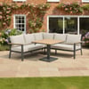 Elegant outdoor patio furniture set with a sectional sofa and square table, perfect for garden entertaining or relaxing in a landscaped backyard.