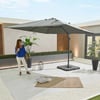 Light gray outdoor patio umbrella with adjustable height, providing shade for a modern backyard space with potted plants and stylish decor.