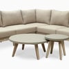 Modern outdoor sectional sofa with beige cushions and natural wood accents, perfect for garden and patio decor.