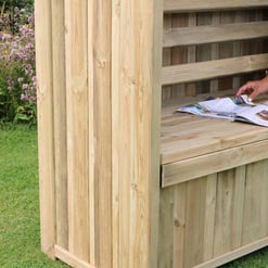 Wooden garden shed with seating area, showcasing backyard outdoor storage solutions. Perfect for garden organization, outdoor furniture, and backyard decor.