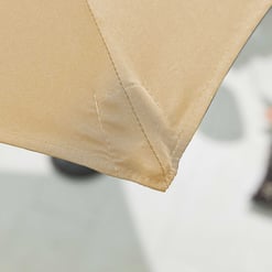 Weather-resistant beige outdoor fabric with reinforced stitching, ideal for patios and garden furniture.