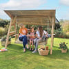 Wooden outdoor garden swing with canopy, perfect for relaxing with family in a lush, landscaped backyard. Ideal for garden furniture, outdoor living, and backyard décor.
