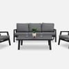 Contemporary outdoor patio furniture set with gray cushions, black metal frame, coffee table, and decorative plant for stylish garden and backyard entertainment.