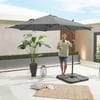 Waterproof patio umbrella set up with a man enjoying a drink in an outdoor space, featuring modern decor and lush greenery, perfect for outdoor living, shade, and garden comfort.