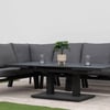 Modern outdoor sectional sofa set with dark gray cushions and black metal frame, perfect for garden or patio entertaining, featuring a sleek coffee table with decorative plants and glasses.