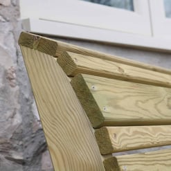 Fence railing made of natural wood with metal screws, outdoors, architectural detail for home and garden projects.