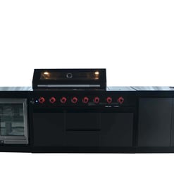 Modern outdoor kitchen with built-in grill, mini fridge, and stainless steel sink, perfect for outdoor entertaining and backyard cooking. Stylish black cabinetry and sleek design.