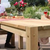 Handcrafted outdoor wooden dining table with a natural finish, ideal for garden entertaining, featuring sturdy construction and spacious surface, perfect for family gatherings and outdoor meals.