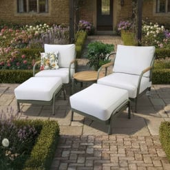 Elegant outdoor patio furniture set with white cushions, ideal for garden or backyard relaxation areas. Perfect for enhancing your outdoor living space with stylish, comfortable seating.