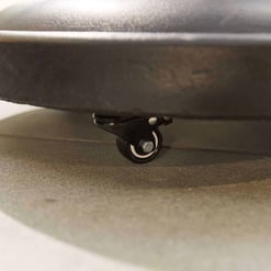 Wheel caster attached to a piece of furniture or equipment, providing mobility and support for smooth transportation. Ideal for furniture, carts, and industrial applications.