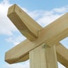 Rough wooden crossbeam for outdoor pergola or gazebo construction, showcasing sturdy timber framing, ideal for garden or backyard projects, durable and weather-resistant lumber for home improvement.