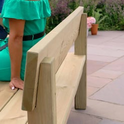 Solid wood park bench for outdoor garden seating, ideal for patios and gardens.