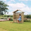 Cozy wooden garden shelter with bench, ideal for outdoor relaxation and patio decor, surrounded by lush greenery and vibrant flowers in a spacious yard.