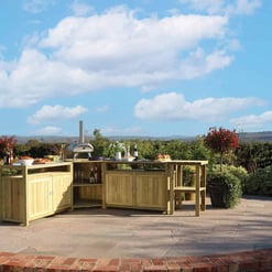Outdoor wooden bar and barbecue area in a scenic garden setting with rolling hills, blue sky, and lush greenery, perfect for outdoor entertaining and gardening enthusiasts.