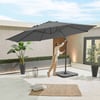 Stylish outdoor patio with a large gray patio umbrella, potted plants, lanterns, and a cozy rug, perfect for garden and outdoor living space enhancements.