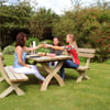 Comfortable outdoor wooden picnic table set surrounded by lush garden greenery, perfect for outdoor dining and entertaining in your backyard.