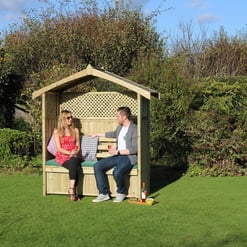 Beautiful backyard scene with a wooden garden gazebo, perfect for outdoor relaxation and entertaining, surrounded by lush greenery and vibrant landscaping.