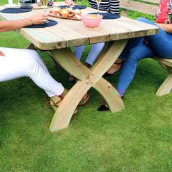 Natural wooden outdoor dining table with benches, perfect for garden gatherings and family meals, showcasing high-quality craftsmanship and durable outdoor furniture from Empire Home and Garden.