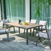 Modern outdoor dining table with six cushioned chairs on patio, perfect for garden entertaining, featuring elegant design by Empire Home and Garden.