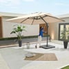 Enjoying a spacious patio with modern outdoor furniture, a large beige umbrella, and lush potted plants for a perfect backyard relaxation area.