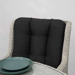 Modern outdoor wicker chair with black cushion, ideal for garden and patio furniture from Empire Home and Garden.