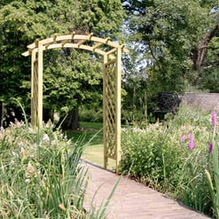 Lush garden with wooden archway entrance, surrounded by colorful flowers and greenery, ideal for outdoor home and garden landscaping.