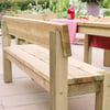 Solid wood outdoor picnic bench and table set in a lush garden setting for outdoor dining and entertaining. Perfect for backyard gatherings, patio, or garden decor.