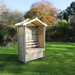 Wooden garden bench with a trellis backrest and partial roof in a lush green backyard. Perfect for outdoor relaxation, gardening, and enhancing your landscape with quality garden furniture.