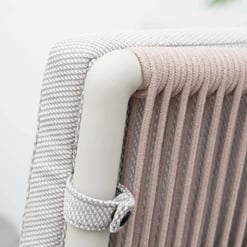 Soft upholstered armrest detail showcasing modern furniture design with textured fabric and neutral tones for stylish, comfortable home decor.