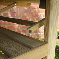 Staining wooden outdoor furniture, garden porch furniture, natural wood finish, high-quality craftsmanship, Empire Home and Garden.