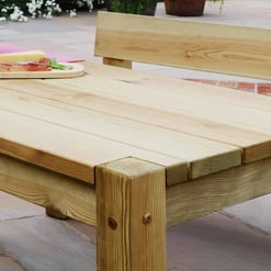 Natural wooden outdoor dining table with chairs, ideal for garden or patio entertainment, enhancing home and garden aesthetic.