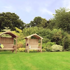 Wooden garden arbor swing set, outdoor relaxation space with benches and shade, perfect for backyard patio or garden decor, surrounded by lush greenery and blooming plants, ideal for outdoor leisure and entertaining.