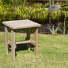 Rustic wooden outdoor side table in a garden pond setting, perfect for backyard patio decor and landscaping projects.