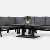 Modern outdoor patio furniture set in gray cushions with black metal frame, complemented by potted plants and glassware for a stylish garden or porch look.