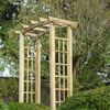 Natural wood garden archway for outdoor landscaping and decorative garden design.