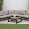 Modern outdoor sectional sofa with plush cushions and sleek black metal frame, perfect for garden or patio relaxation.