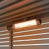 Outdoor patio heater mounted on a stylish slatted pergola for warmth and ambiance, ideal for patios, gardens, and outdoor living spaces.