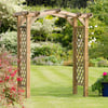 Wood garden arbor with lattice sides and curved top in a lush, colorful landscape—perfect for enhancing outdoor patio or backyard decor.