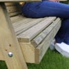Roughly textured wooden garden bench built with pressure-treated lumber, ideal for outdoor home and garden relaxation. Durable wood construction designed for outdoor furniture use.