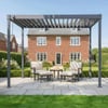 Stylish outdoor patio with modern outdoor furniture and a pergola, perfect for relaxing in the backyard garden of a classic brick home. Enhances outdoor living and garden aesthetics.