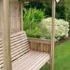 Wooden garden bench under a backyard pergola with lush garden flowers and greenery in the background, perfect for outdoor relaxation and garden decor.