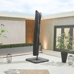 Modern outdoor patio featuring a black umbrella, potted plants, lanterns, and contemporary decor, ideal for outdoor living, landscaping, and garden design with stylish accents from Empire Home and Garden.