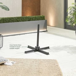 Modern outdoor umbrella stand with cross section base for stability, set on stylish patio with potted plants and contemporary decor for outdoor living.