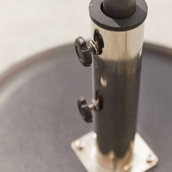 Stainless steel pole with adjustable knobs, part of outdoor patio or garden furniture, durable construction, close-up shot.