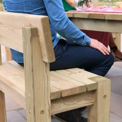 Natural wooden outdoor dining bench and table set, perfect for patio or garden entertaining. Crafted from durable, unfinished wood, offering rustic charm and sturdy seating.