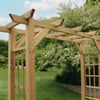 Natural wooden garden arbor in a lush outdoor setting with blossoming trees. Perfect for enhancing your yard with durable, stylish landscape architecture and outdoor garden features.
