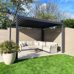 Modern outdoor pergola with a comfortable sectional sofa and coffee table in a backyard setting, ideal for outdoor living and entertaining.